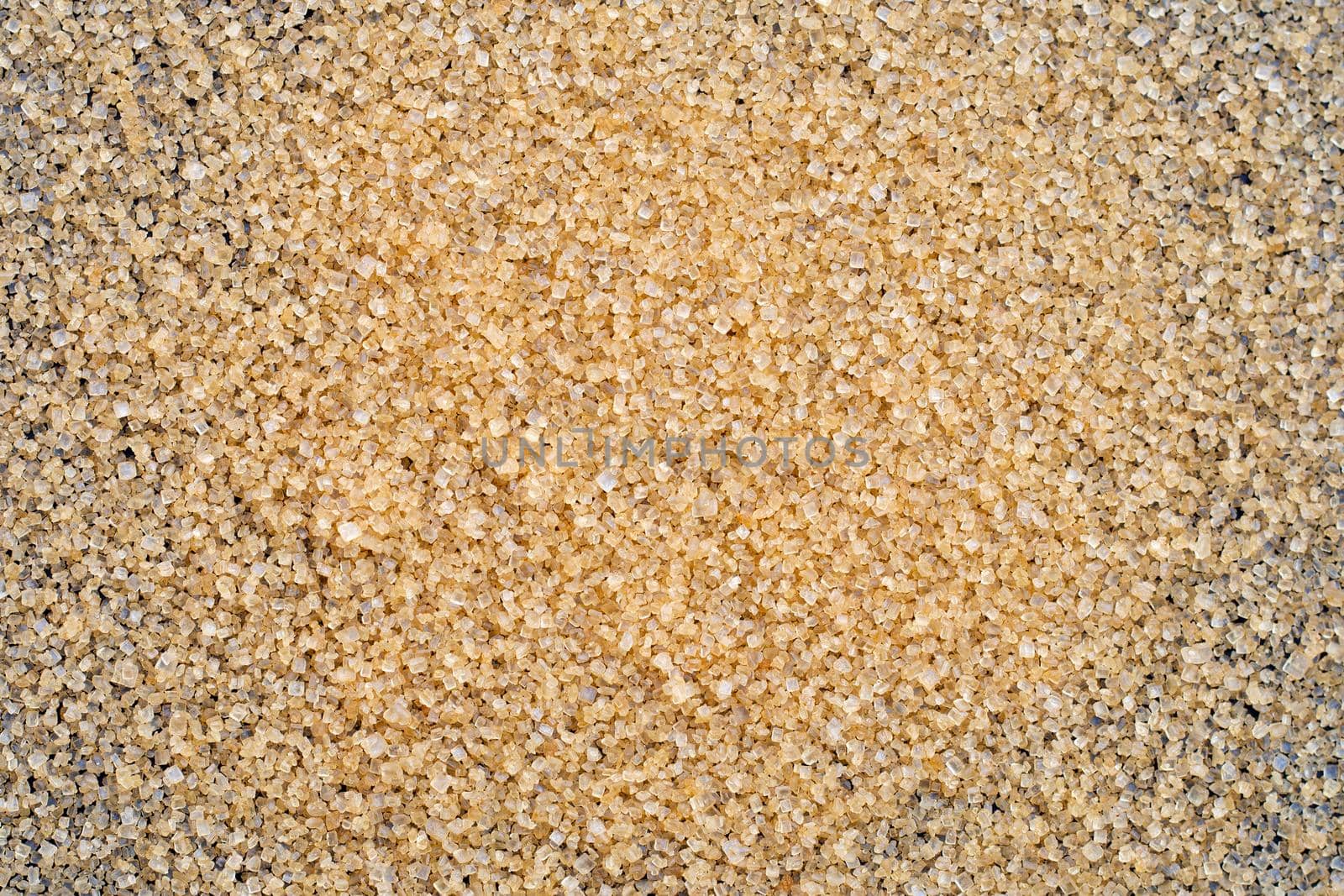 Brown sugar on dark background. 