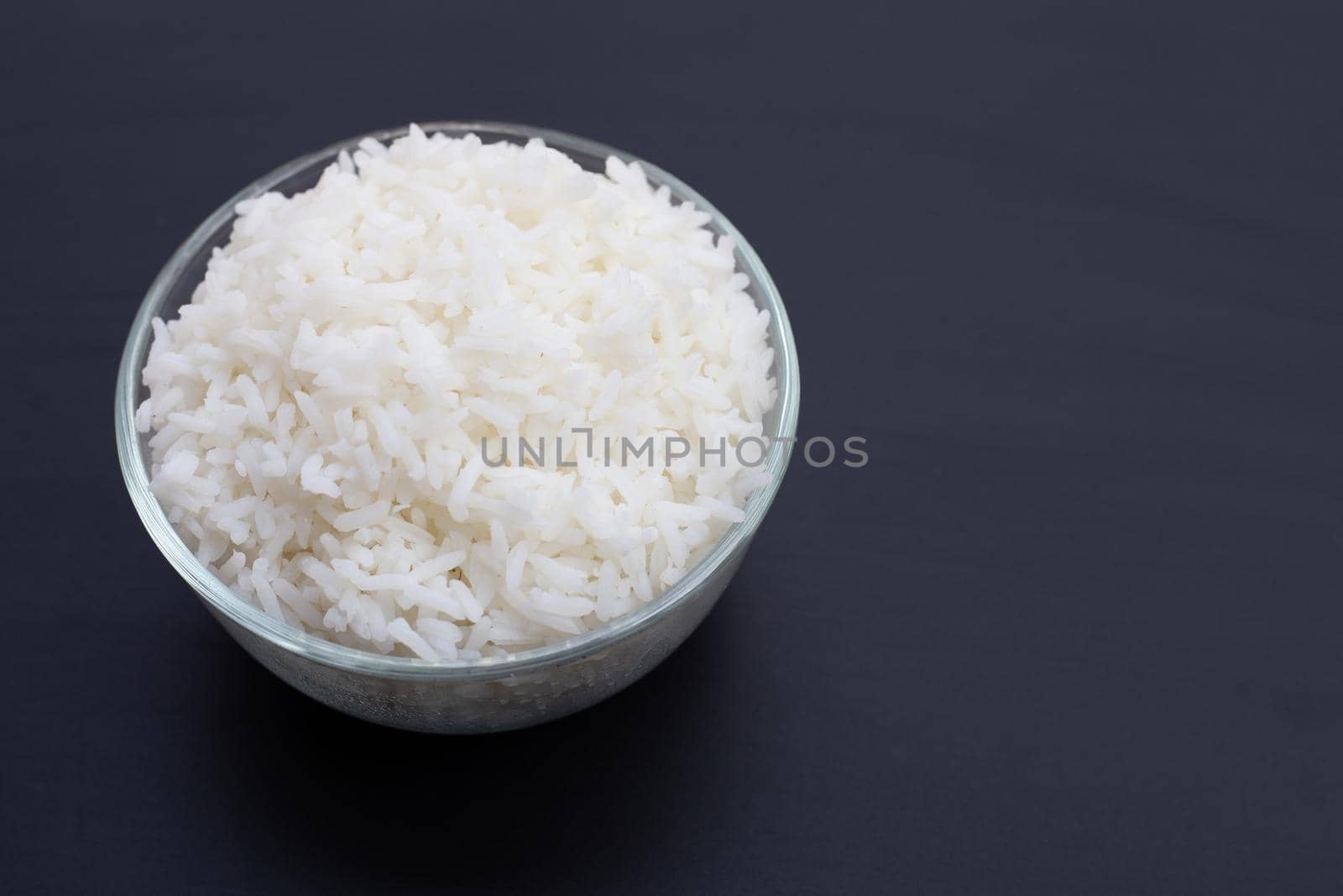 Dish of rice on white background.