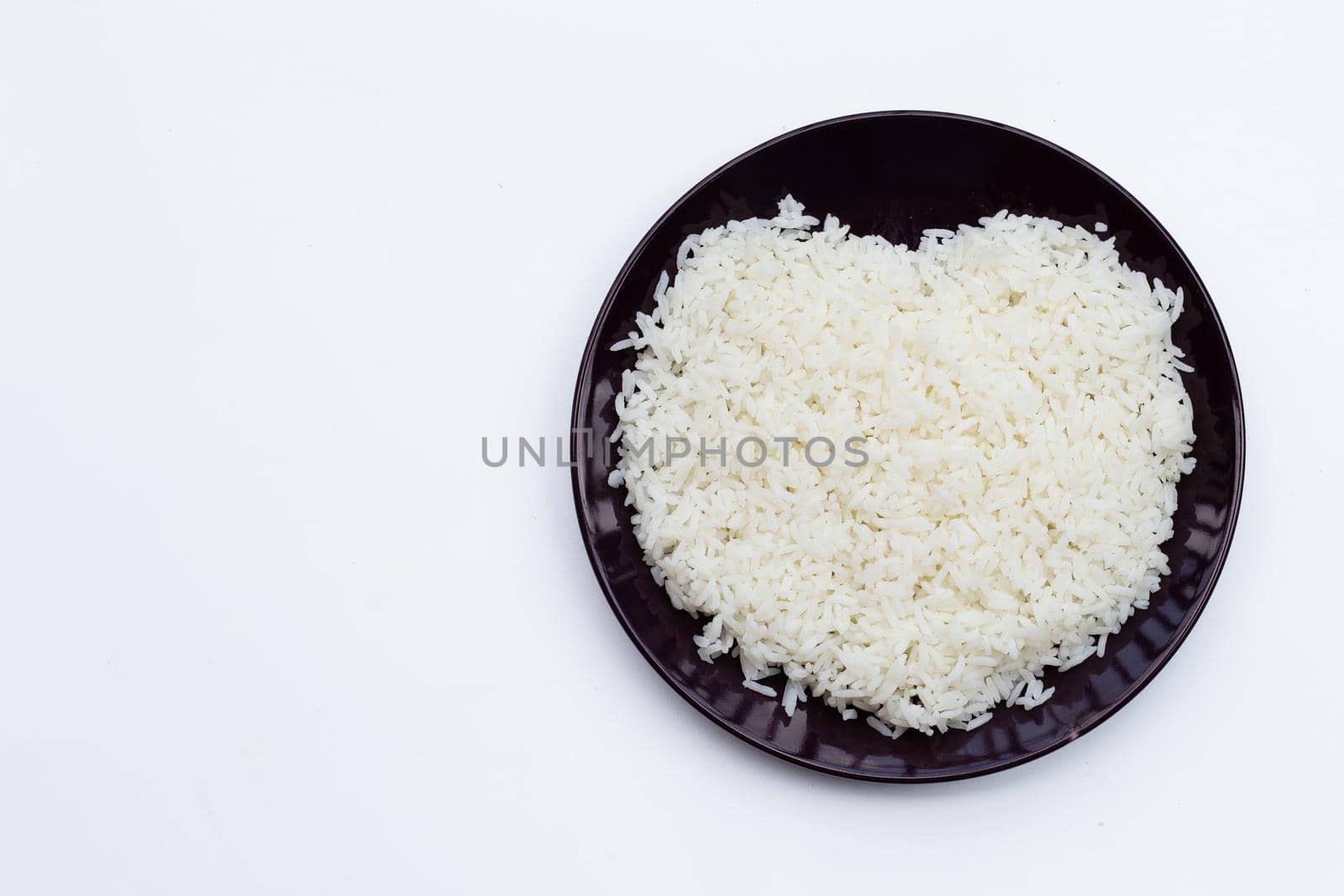 Dish of rice on white background.