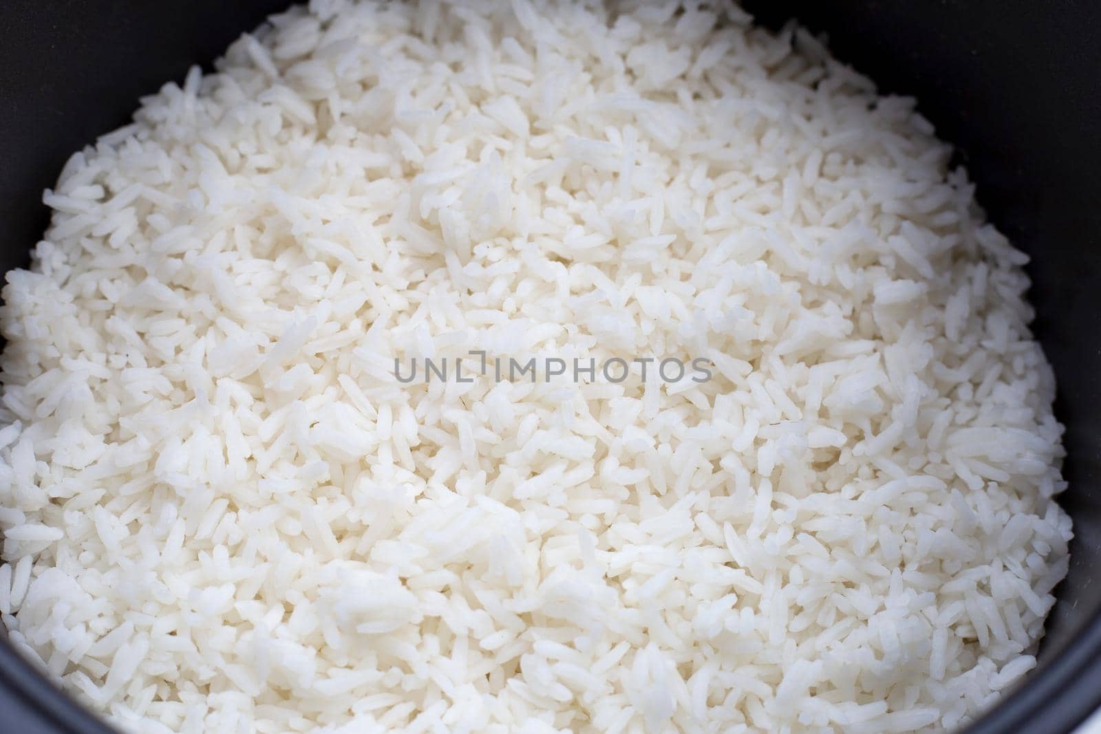 Rice in a rice cooker. Top view