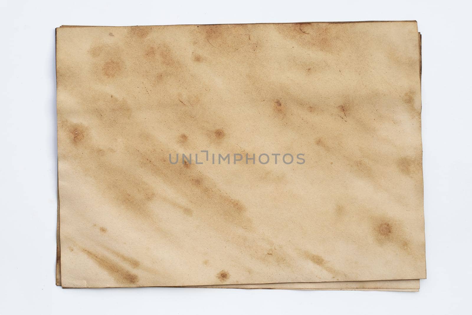Old brown paper grunge background. Abstract liquid coffee color texture.