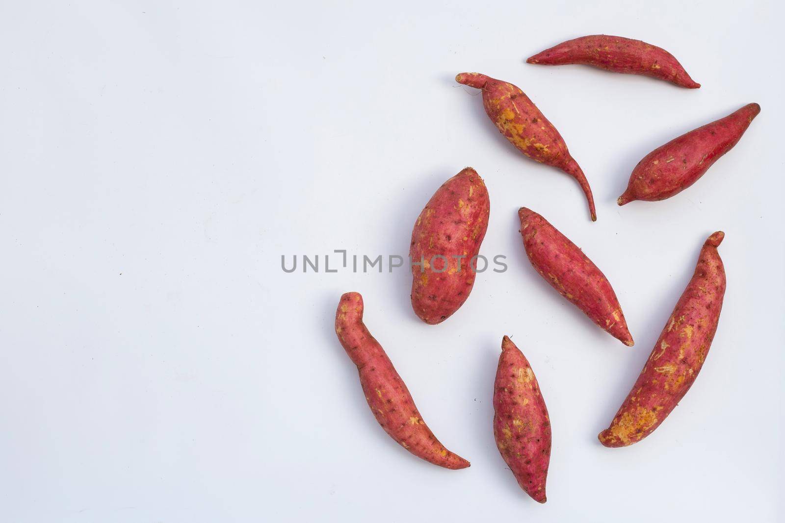 Sweet potato on white background. Top view