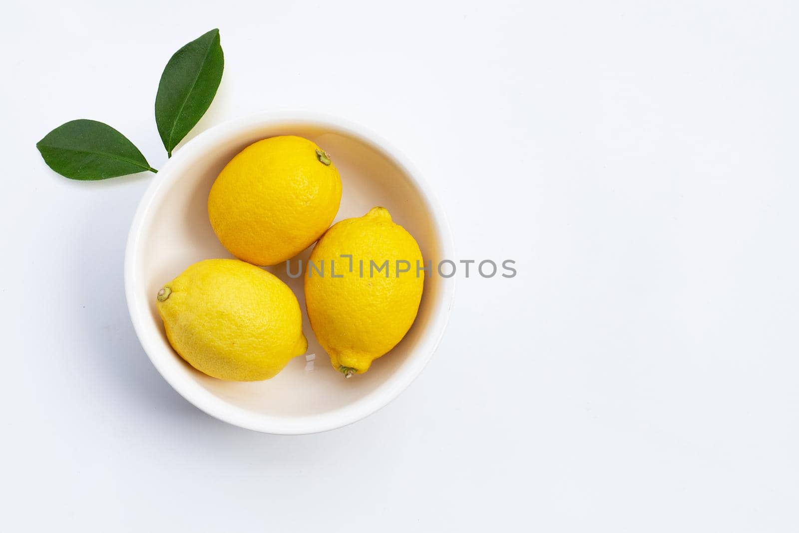Fresh lemon on white background.