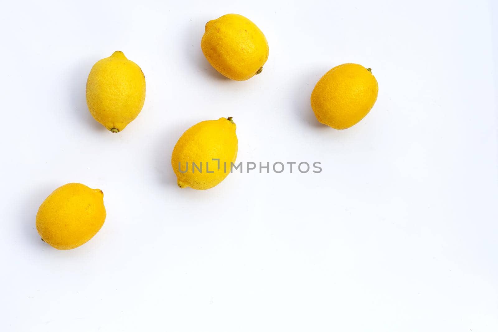 Fresh lemon on white background. Copy space
