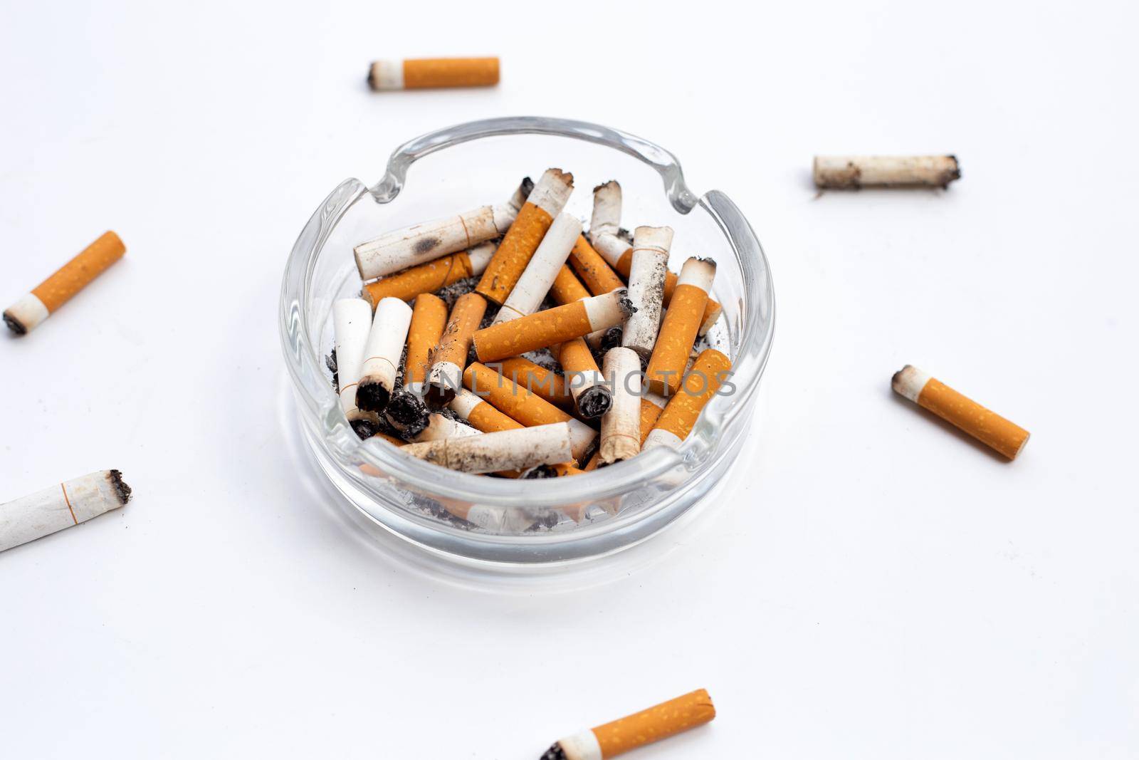 Smoked cigarettes on white background. Copy space