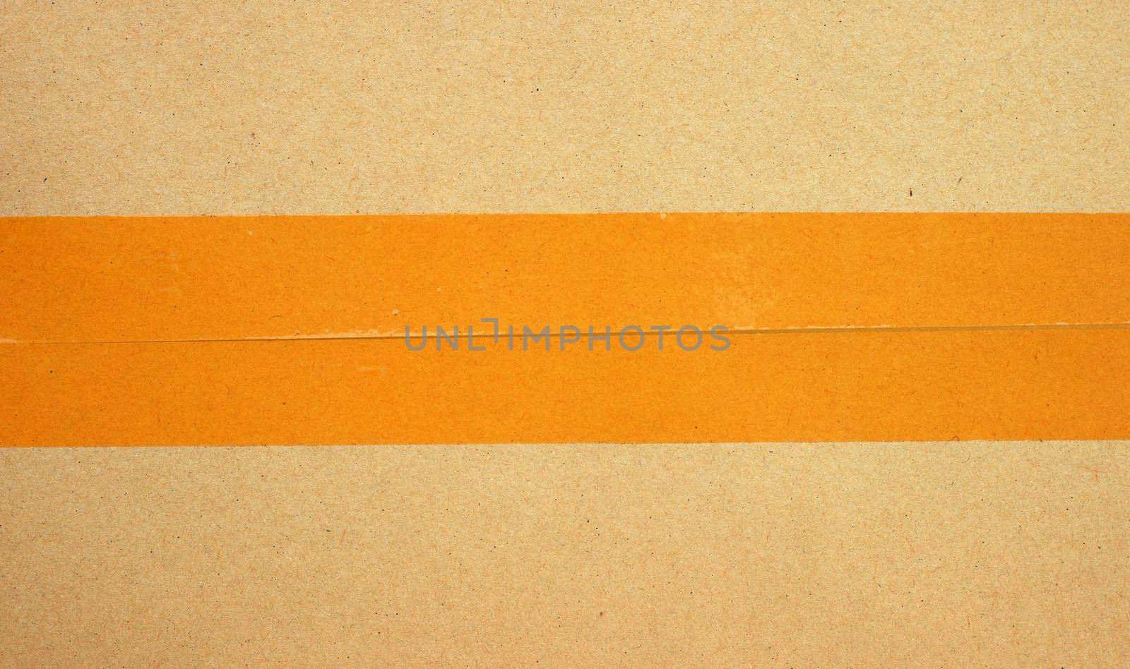 Brown cardboard box with tape 