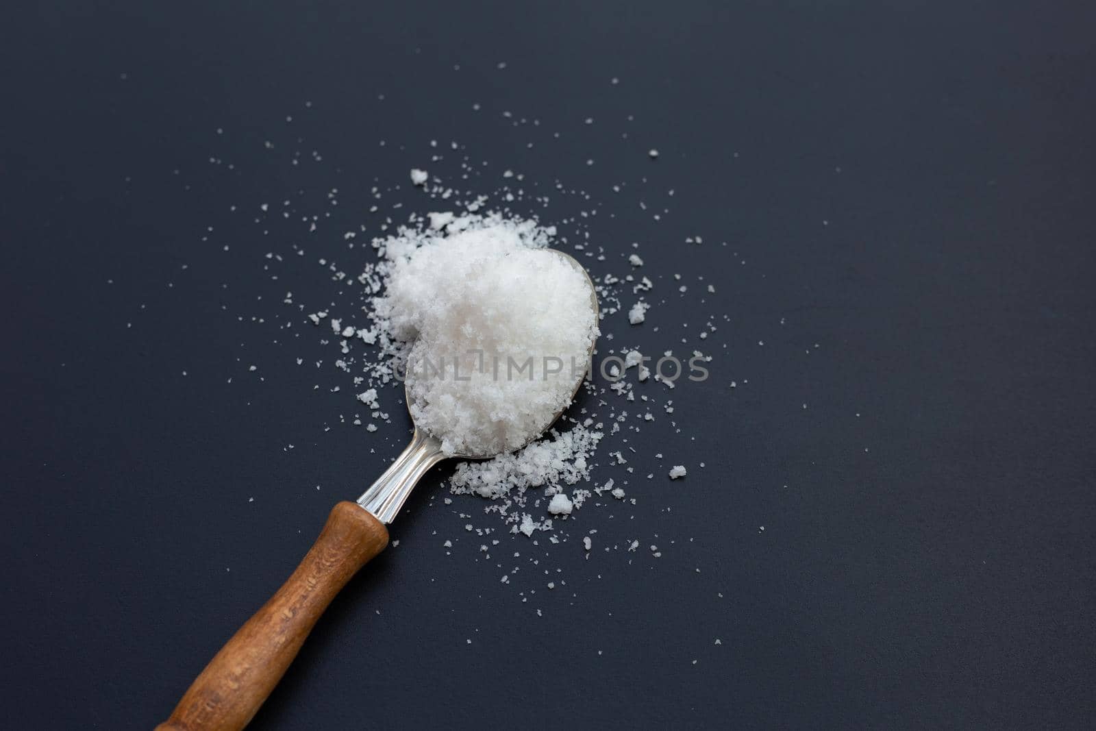 Salt on dark background. copy space