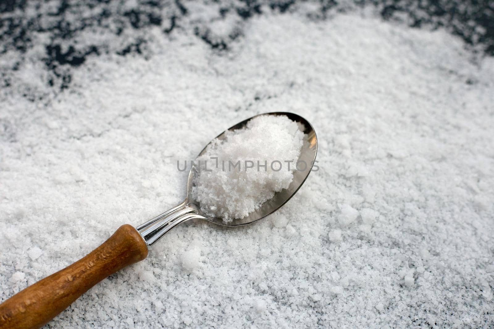Salt on dark background. copy space