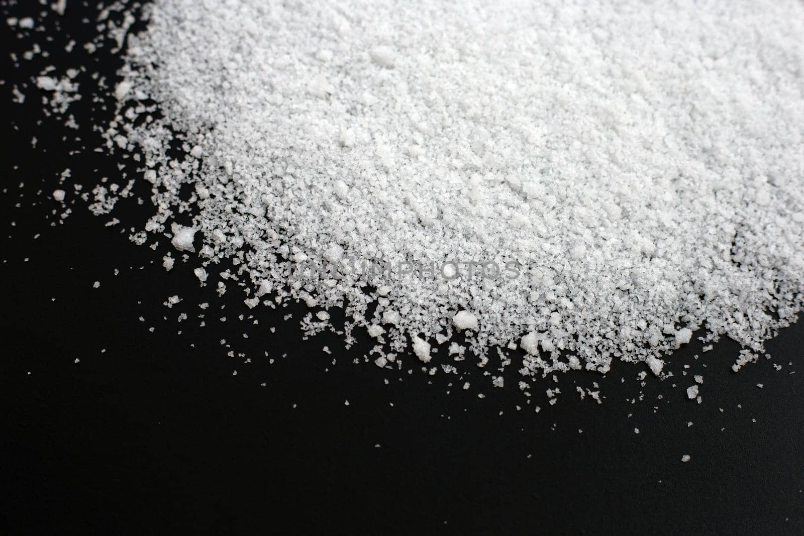 Salt on dark background. copy space