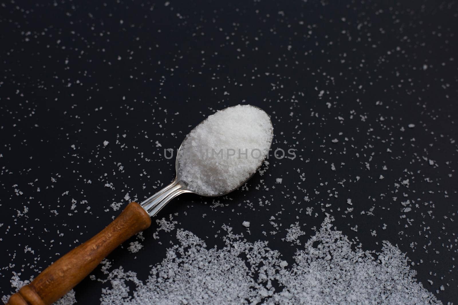 Salt on dark background. copy space