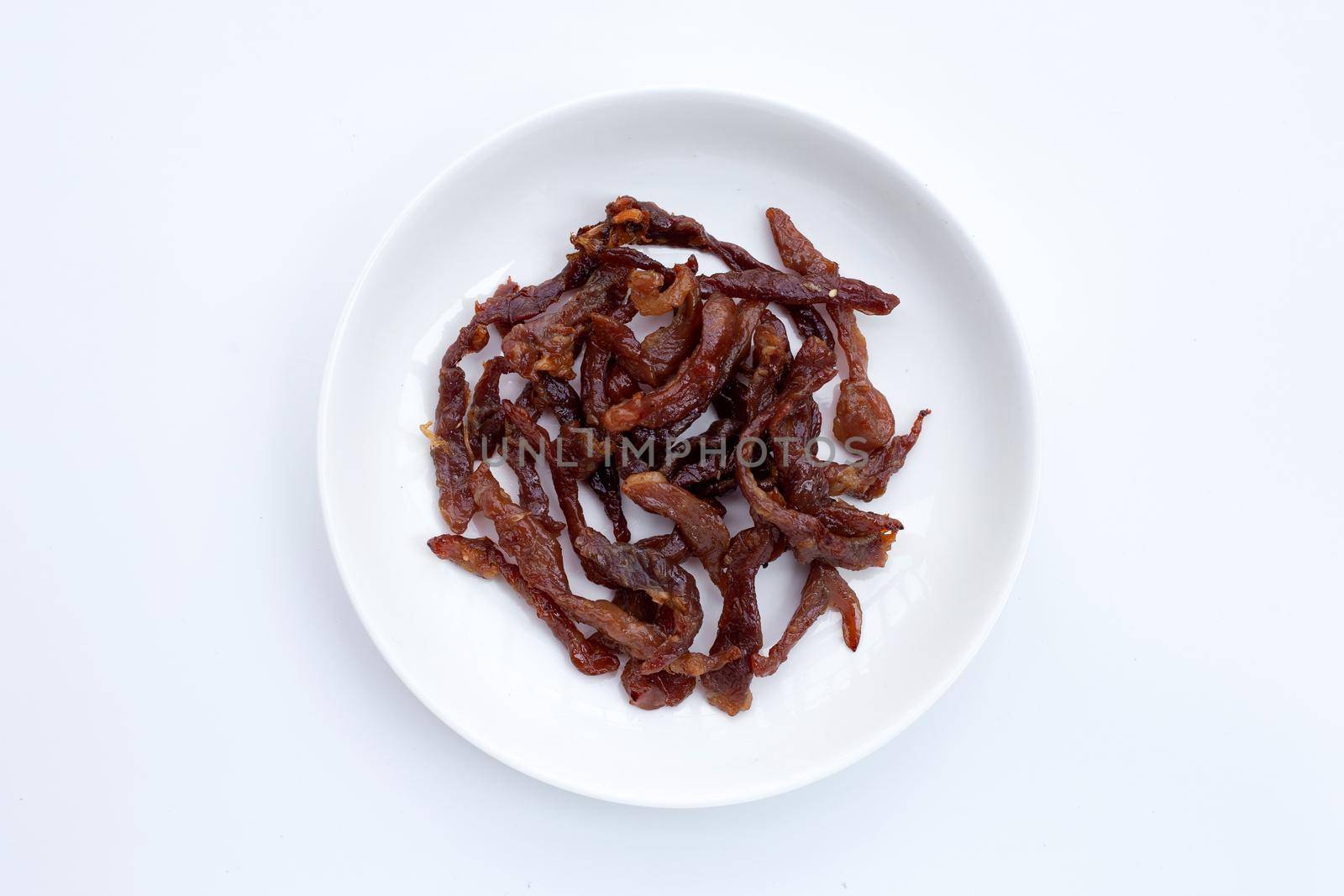 Deep fried sun-dried pork on dark background