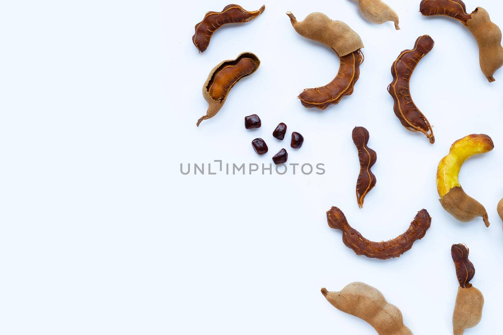 Tamarind tropical fruit on white background. Top view