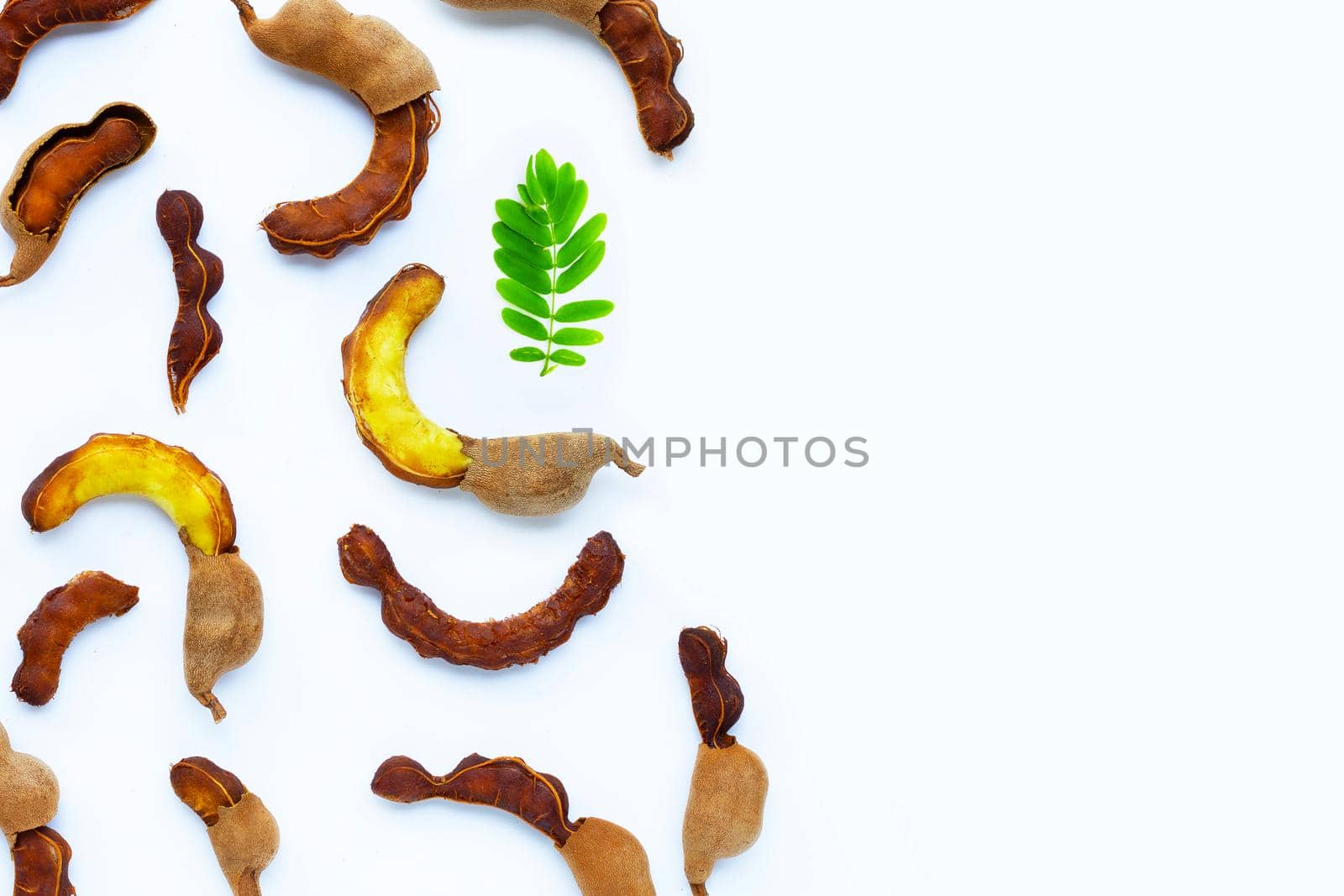 Tamarind tropical fruit on white background. Top view