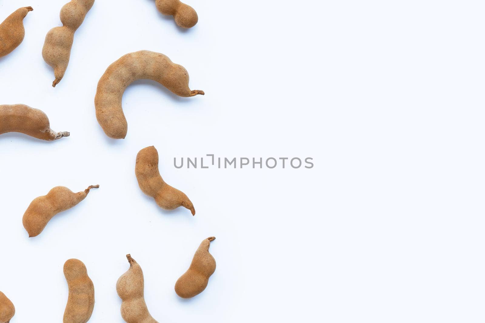 Tamarind tropical fruit on white background. Top view