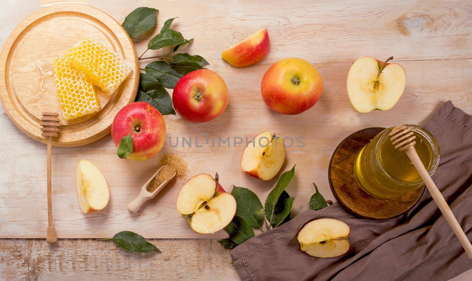 Jewish holiday Rosh Hashana background with apples and honey on blackboard. View from above. Flat lay by aprilphoto