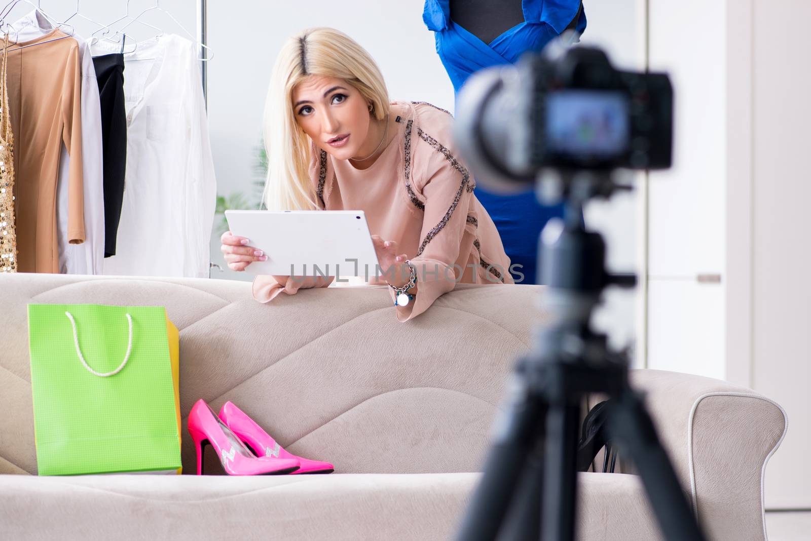 Fashion blogger recording new video for her vlog by Elnur