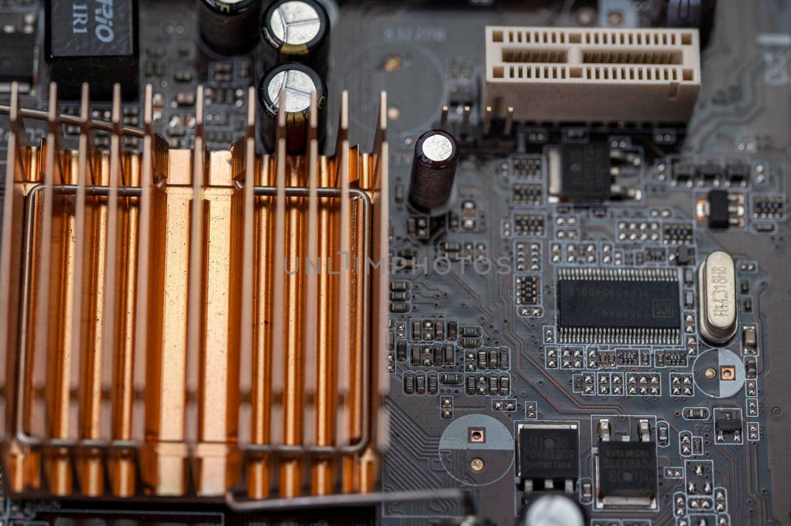 detail of a motherboard with connectors and heatsinks of a fixed computer