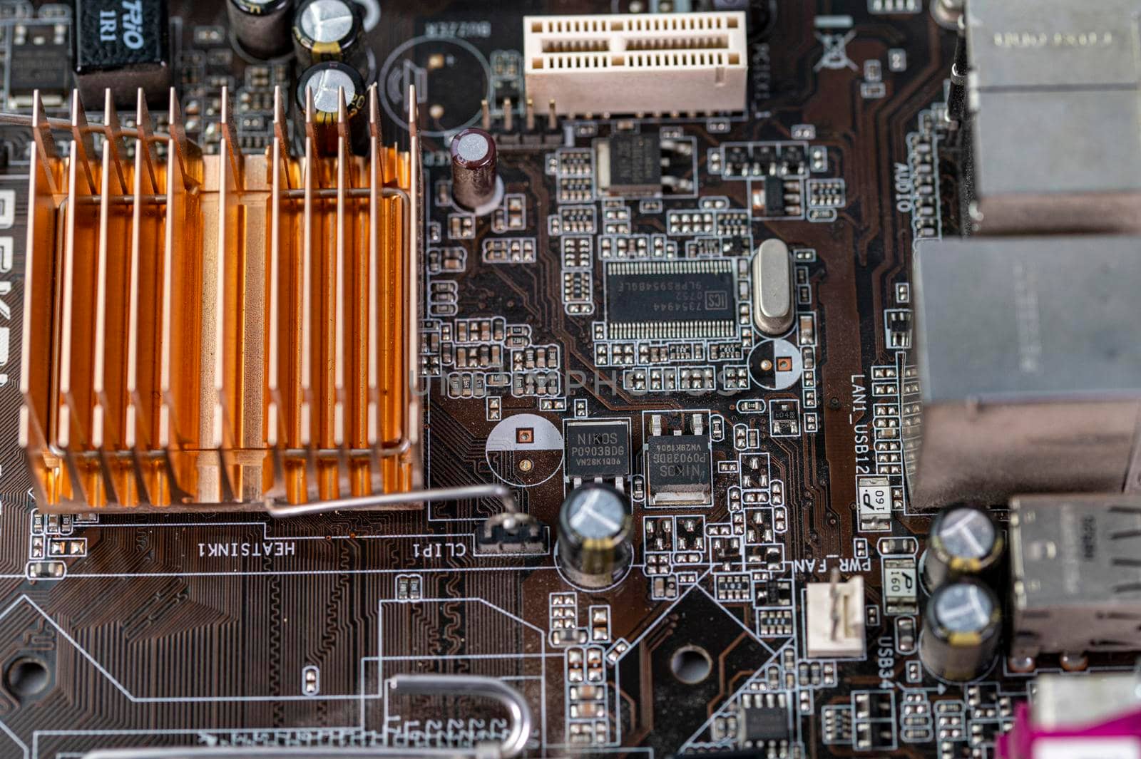 detail of a motherboard with connectors and heatsinks of a fixed computer