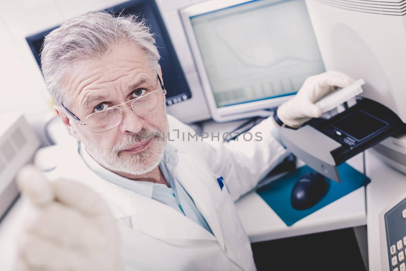 Life science researcher performing a genotyping testing which enables personalized medicine. PM is a medical model that proposes the customization of healthcare.