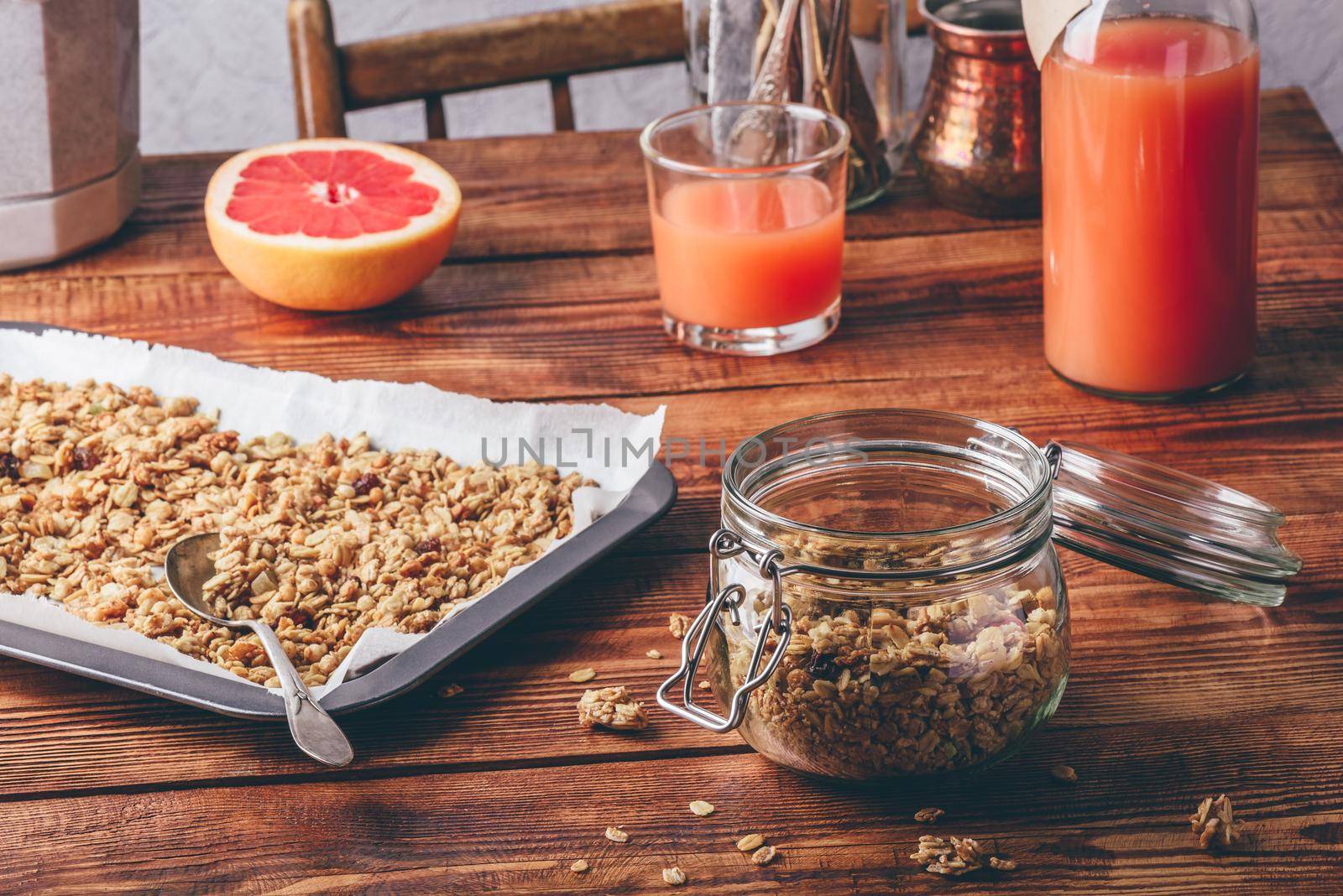 Homemade granola and grapefruit juice for healthy breakfast