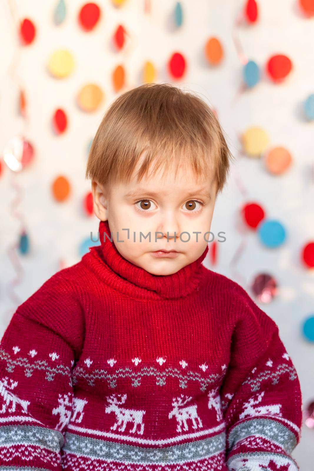 Portrait of a cute boy. Children's emotions. Christmas and new year. The concept of an advertising banner.