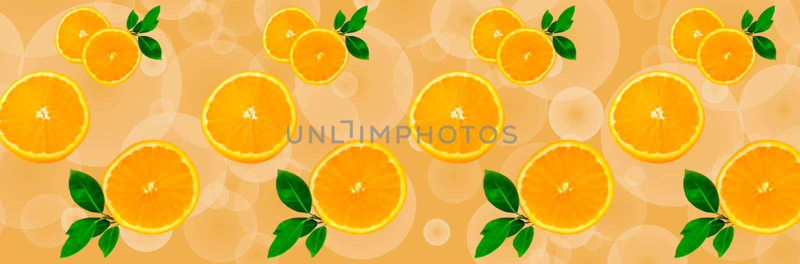 Sliced orange on a bright orange background. Oranges in the panoramic image. Panorama, a banner with space for text or insertion. Pieces of citrus fruit.  by Alina_Lebed