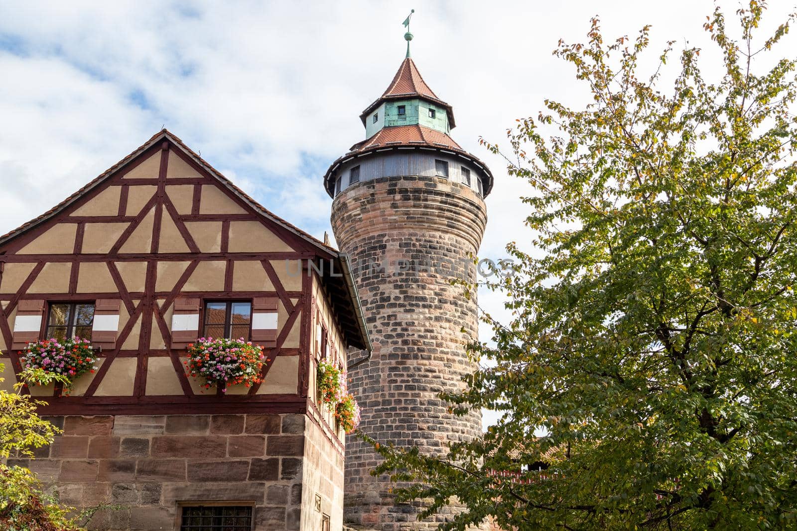 Historic tower and timbered house (frame house) of the Nuremberg castle, Bavaria, Germany  in autunm on a sunny day