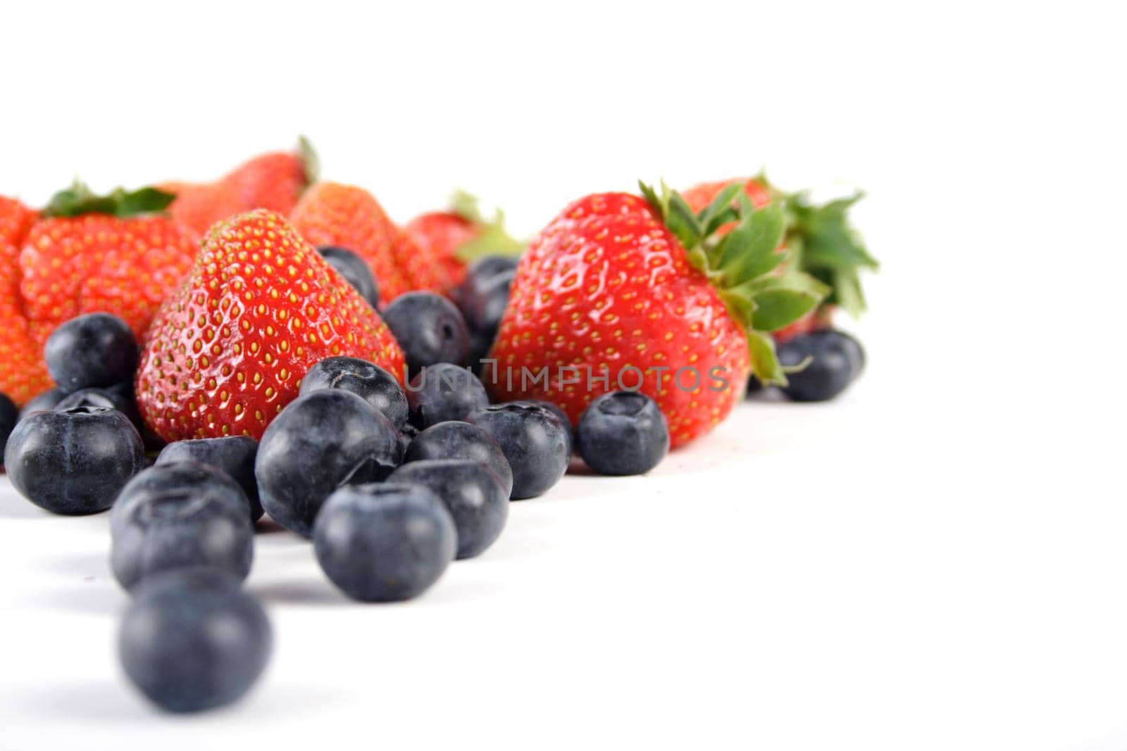 Blueberries and strawberries by moodboard