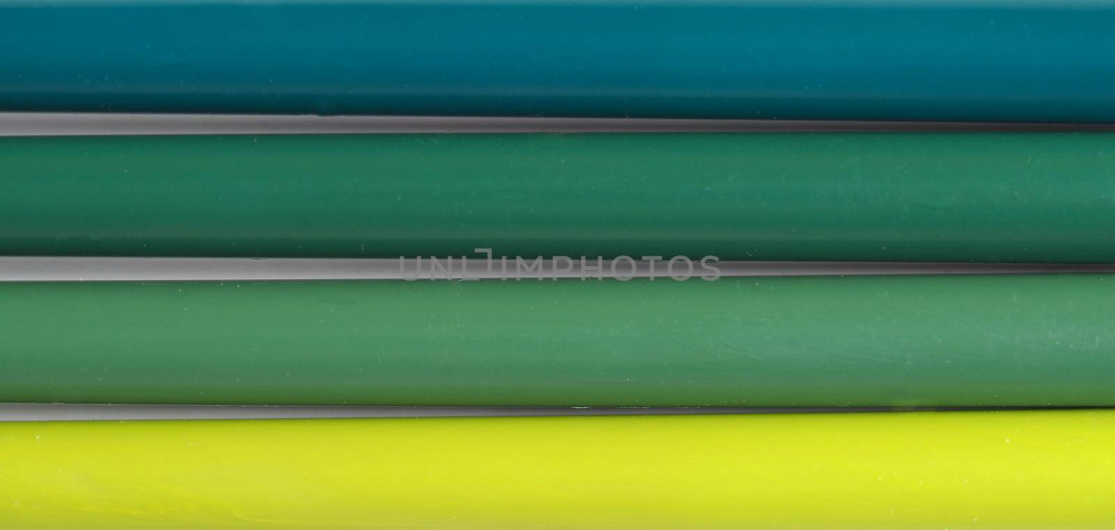 many green felt tip pens on a table