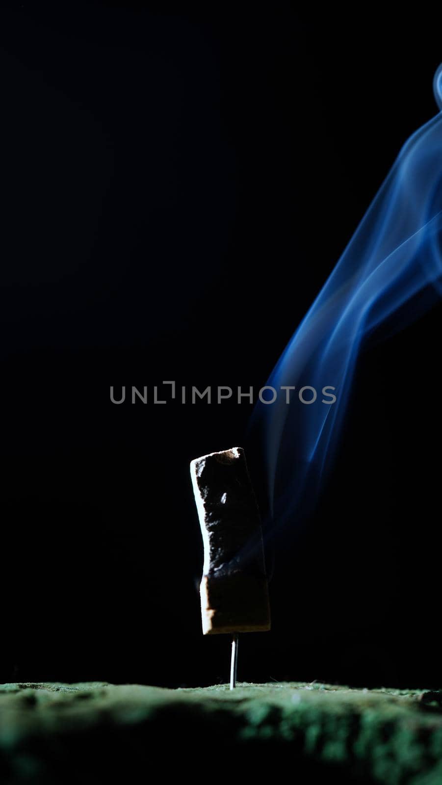 Incense burning incense, white smoke, black background, used as background image Paying homage to the sacred objects of the people of Buddhism according to their beliefs and beliefs.
