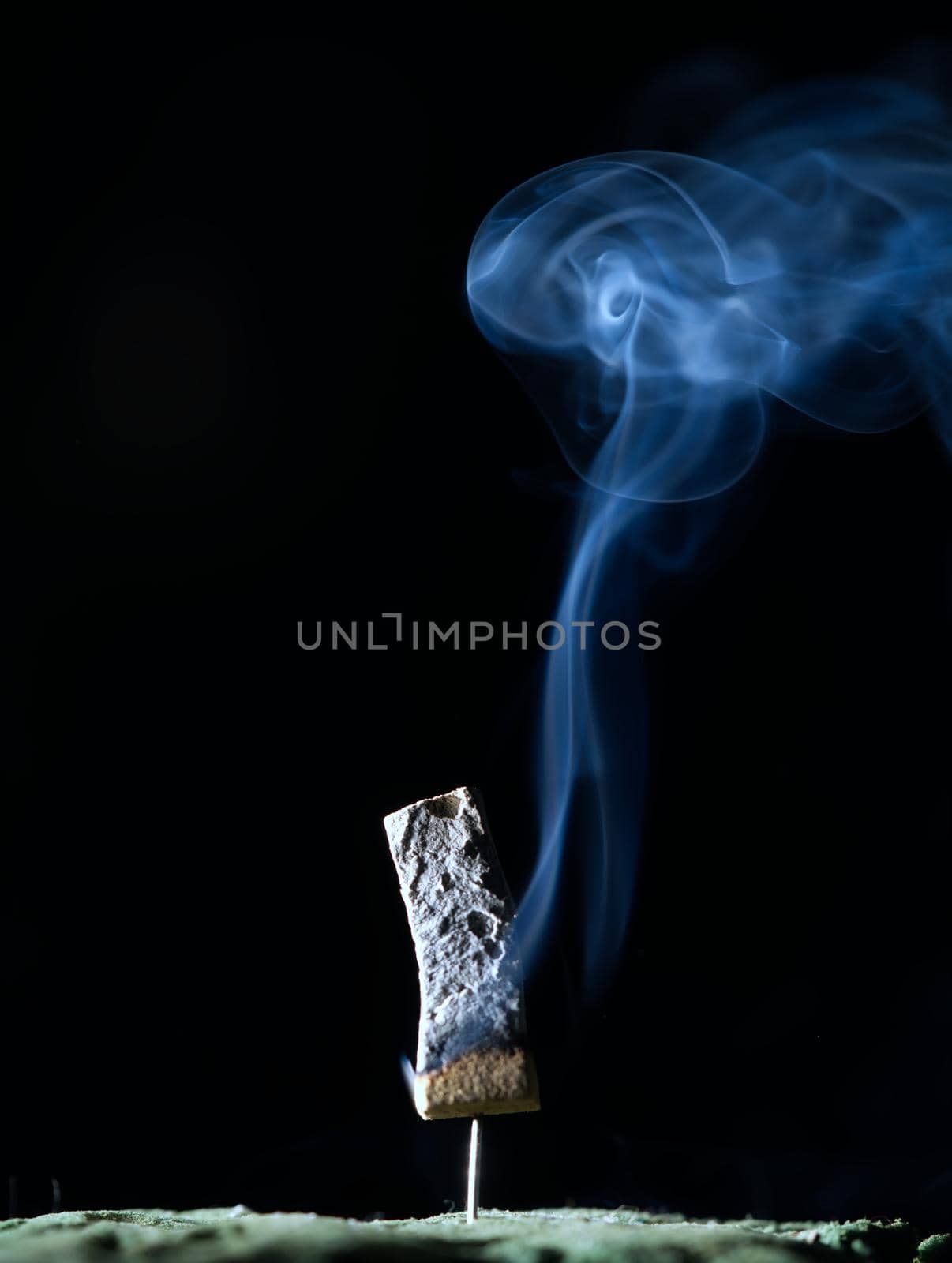 Incense burning incense, white smoke, black background, used as background image Paying homage to the sacred objects of the people of Buddhism according to their beliefs and beliefs.