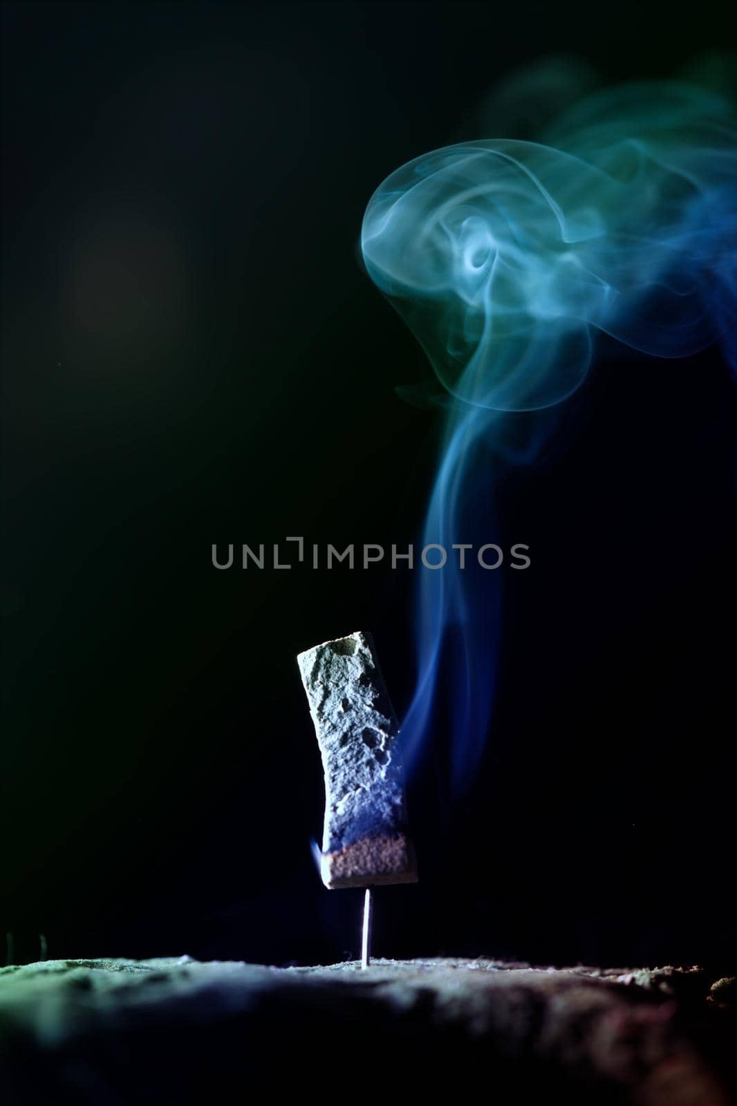 Incense burning incense, white smoke, black background, used as background image Paying homage to the sacred objects of the people of Buddhism according to their beliefs and beliefs.
