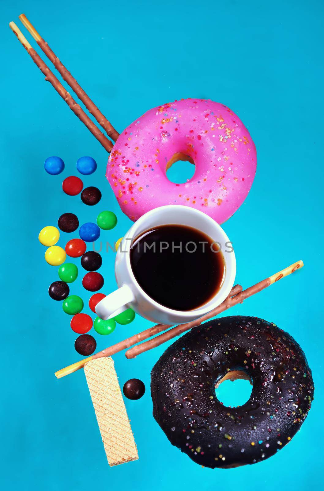 Vertical images of donuts and pastries colorful, pastel blue background. Sweet and snack ideas. by noppha80