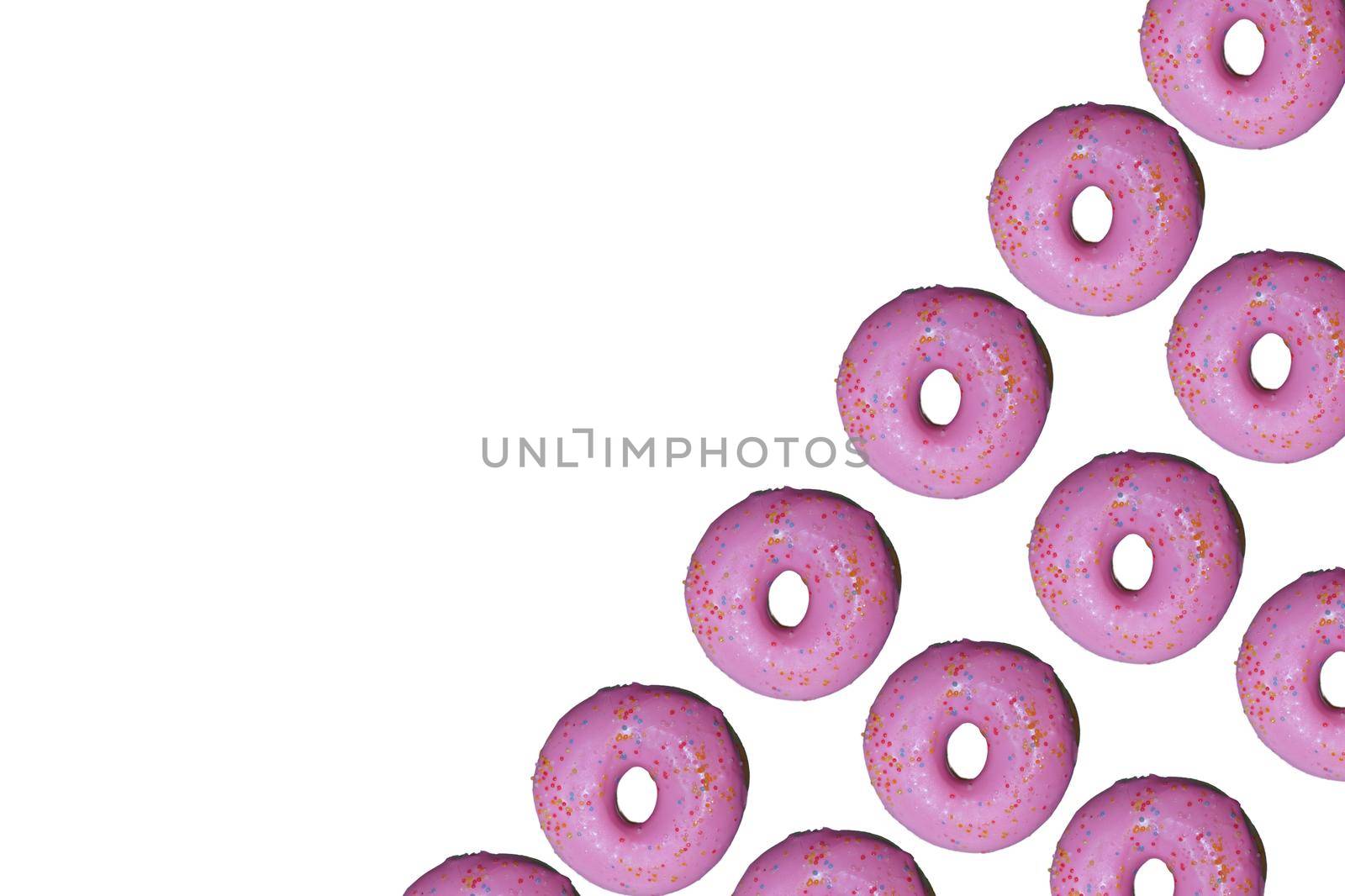 Donut pattern lay flat on isolated white background, top view.