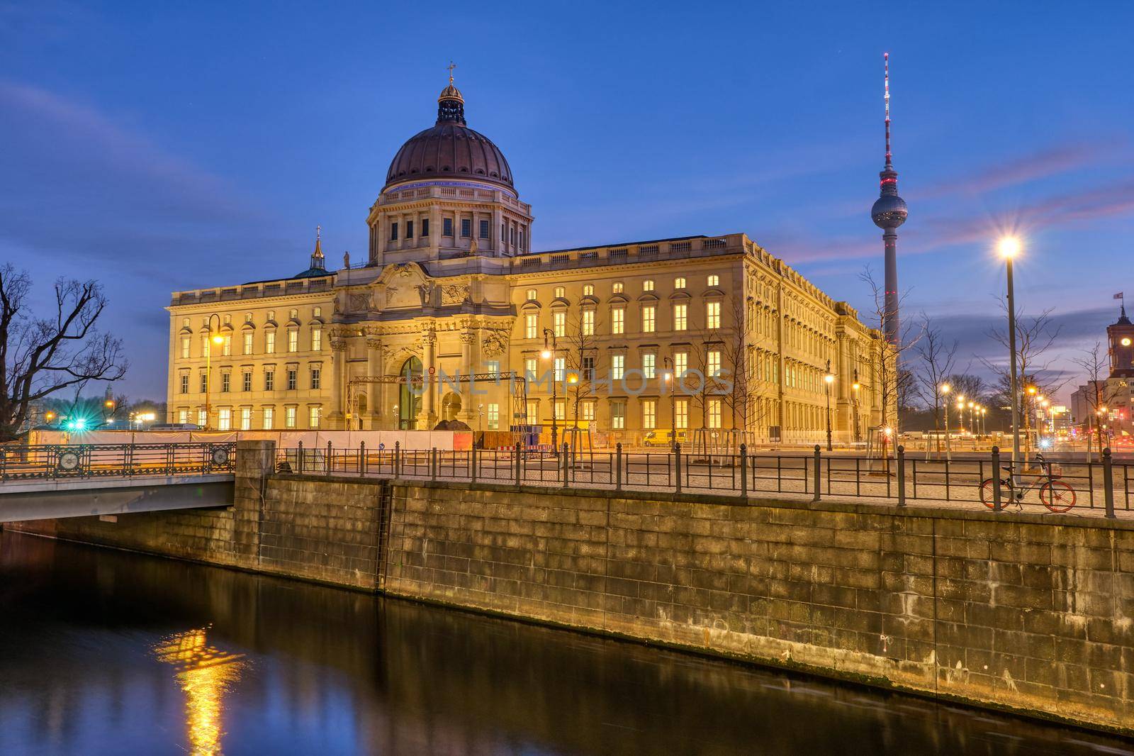 The imposing rebuilt Berlin City Palace with the Television Tower at dawn