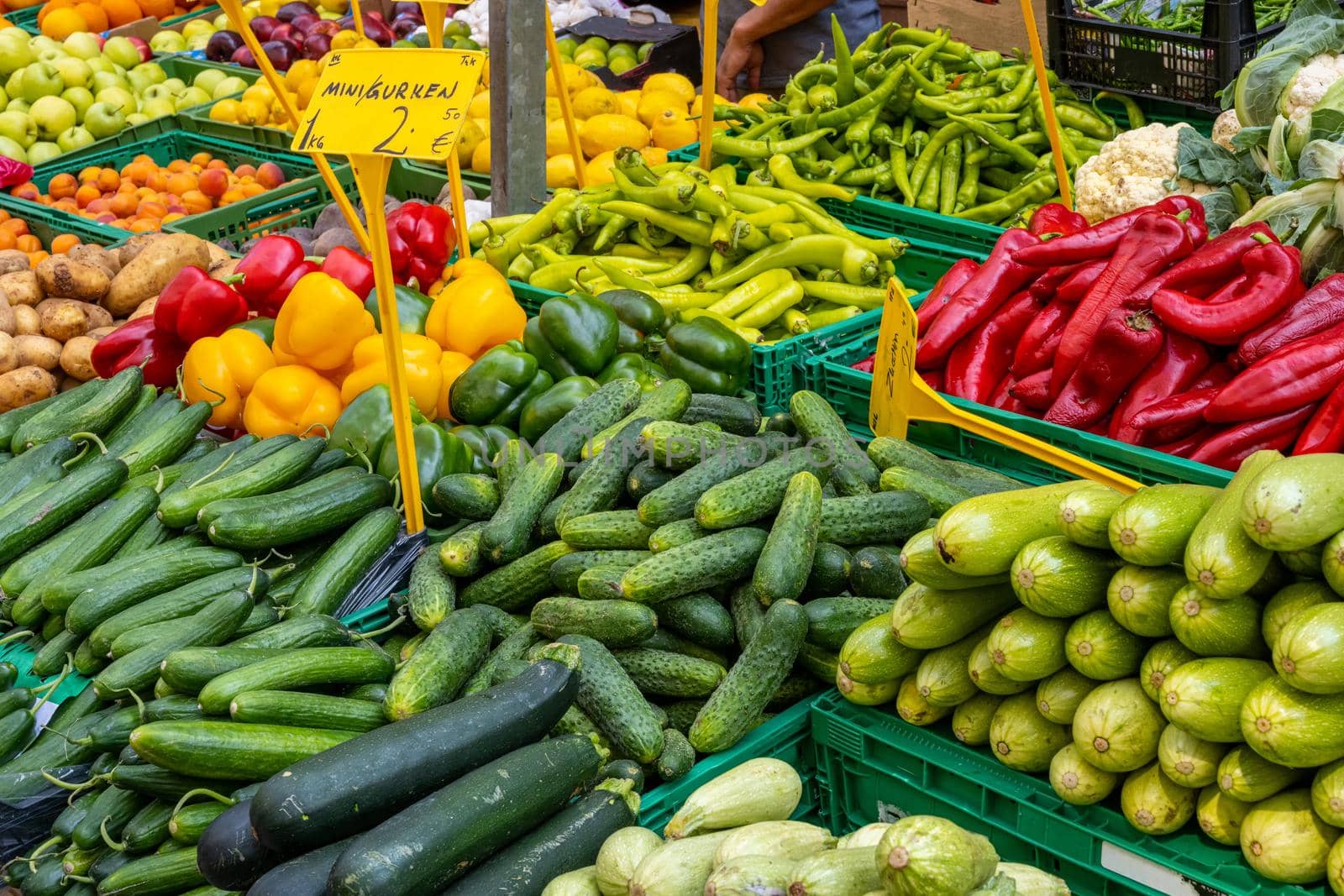 Pickles, bell peppers and other vegetables for sale at a market