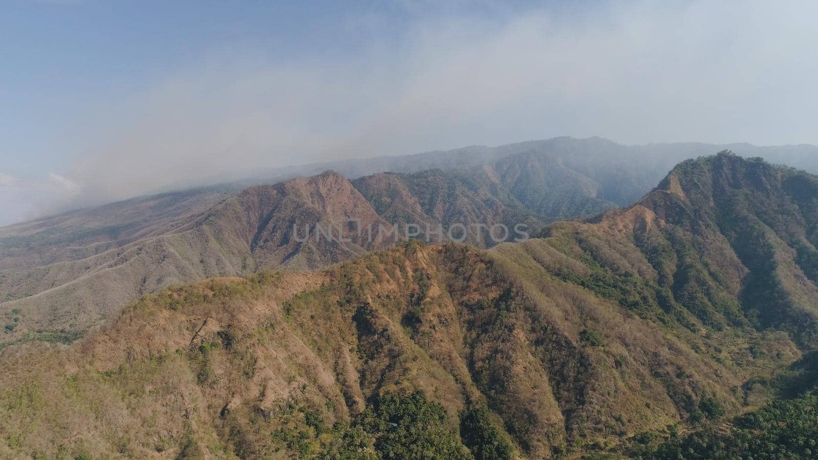 aerial view mountain landscape mountain range with high cliffs. Mountains covered with trees and vegetation. tropical landscape