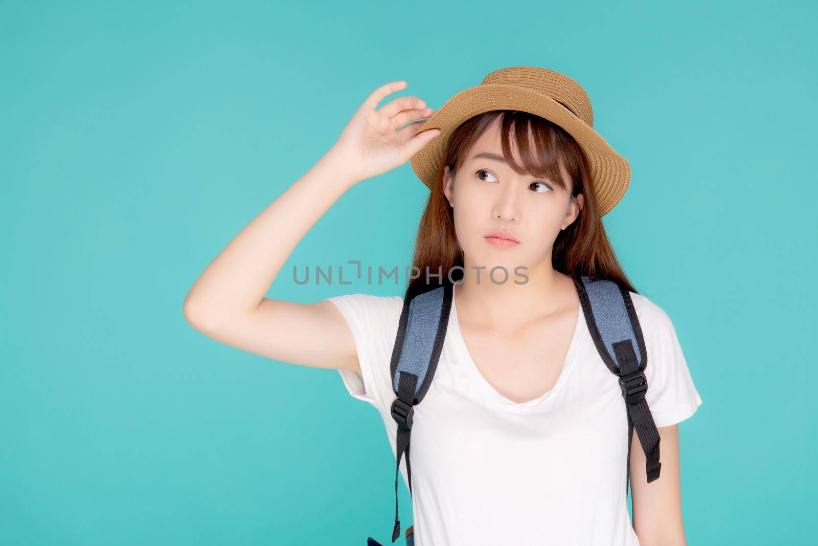 Beautiful young asian woman upset and worry travel summer trip in abroad isolated on blue background, tourist asia girl having problem and stress journey in vacation for leisure, holiday concept.