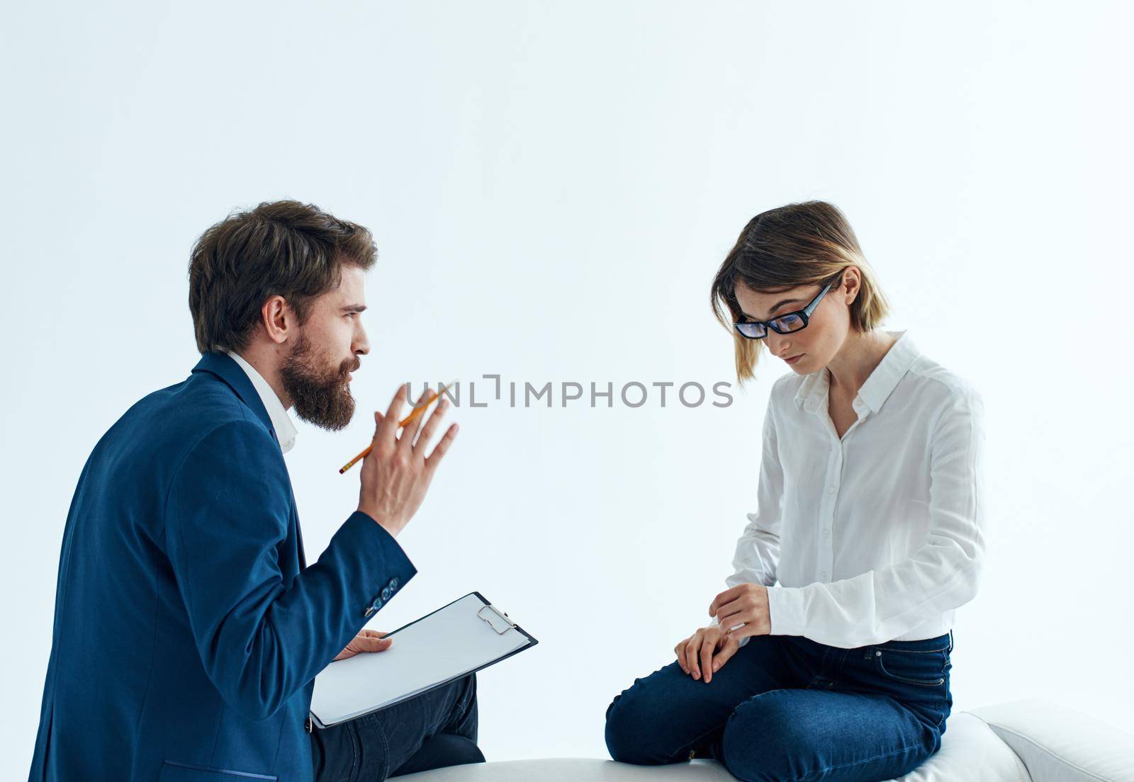 Business men and women sit on the couch communicating employees psychology . High quality photo