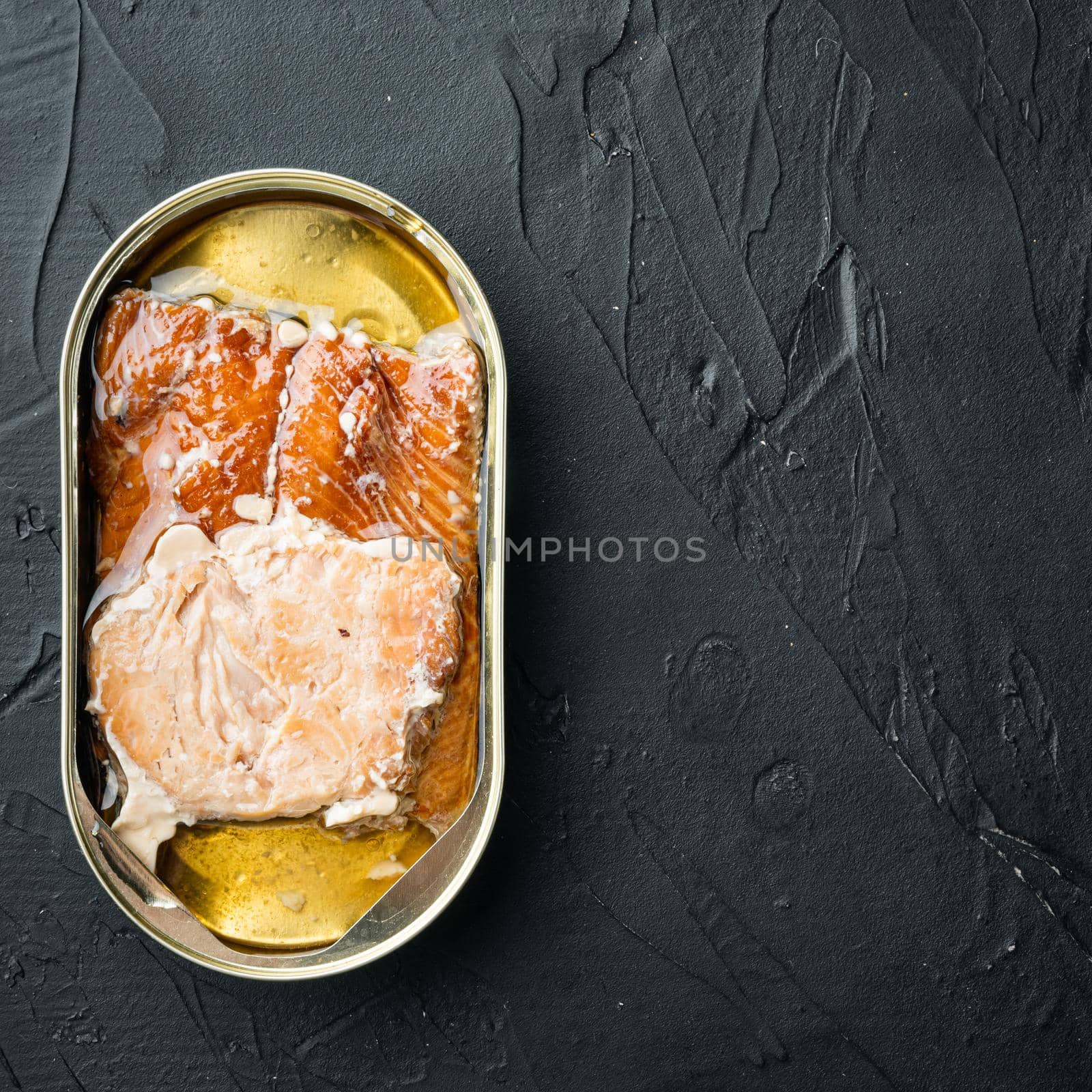 Smoked Salmon Fillets Canned fish set, in tin can, on black background, top view flat lay, with copyspace and space for text, square format