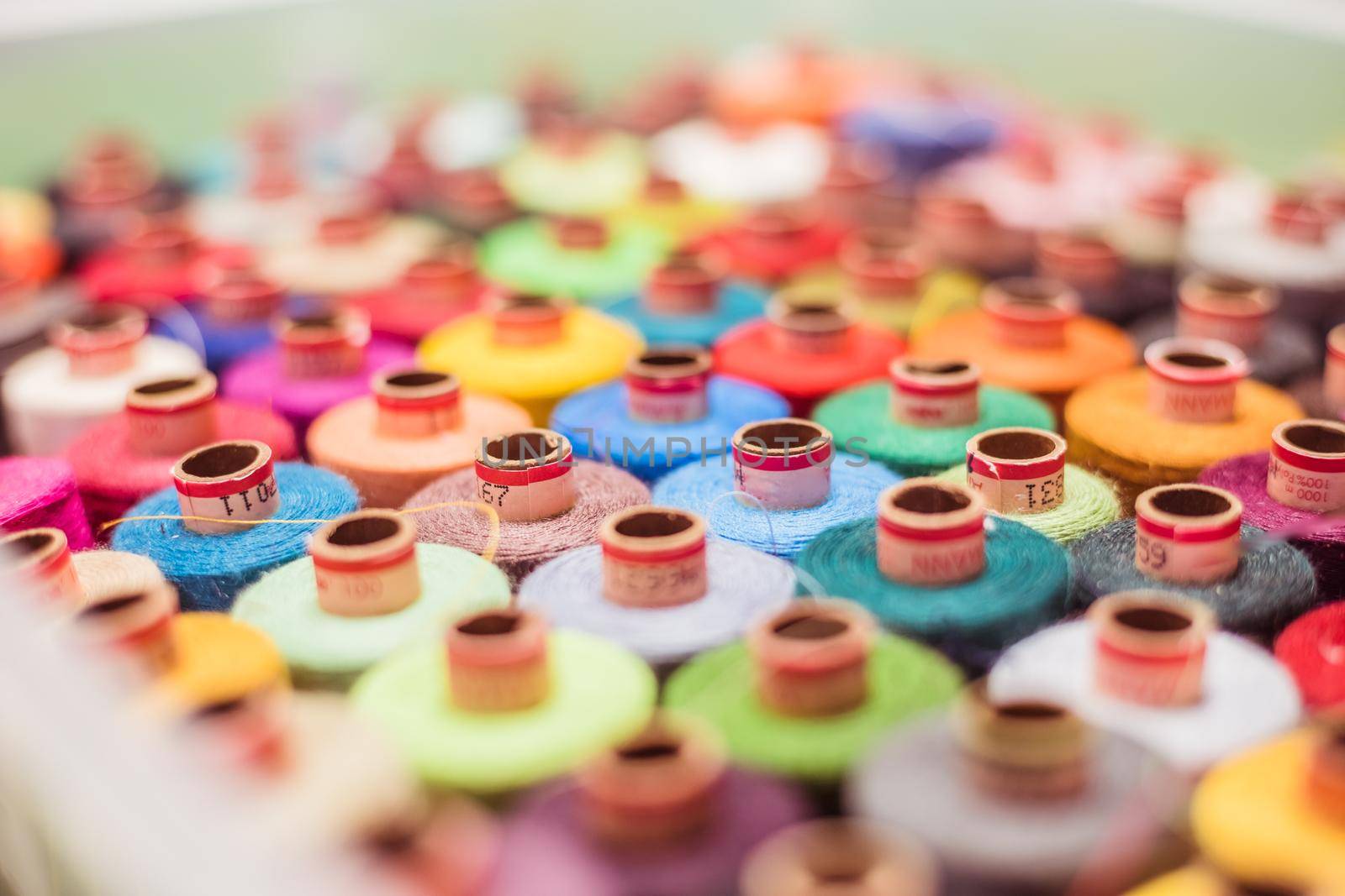 Variety of colorful sewing threads, birds eye
