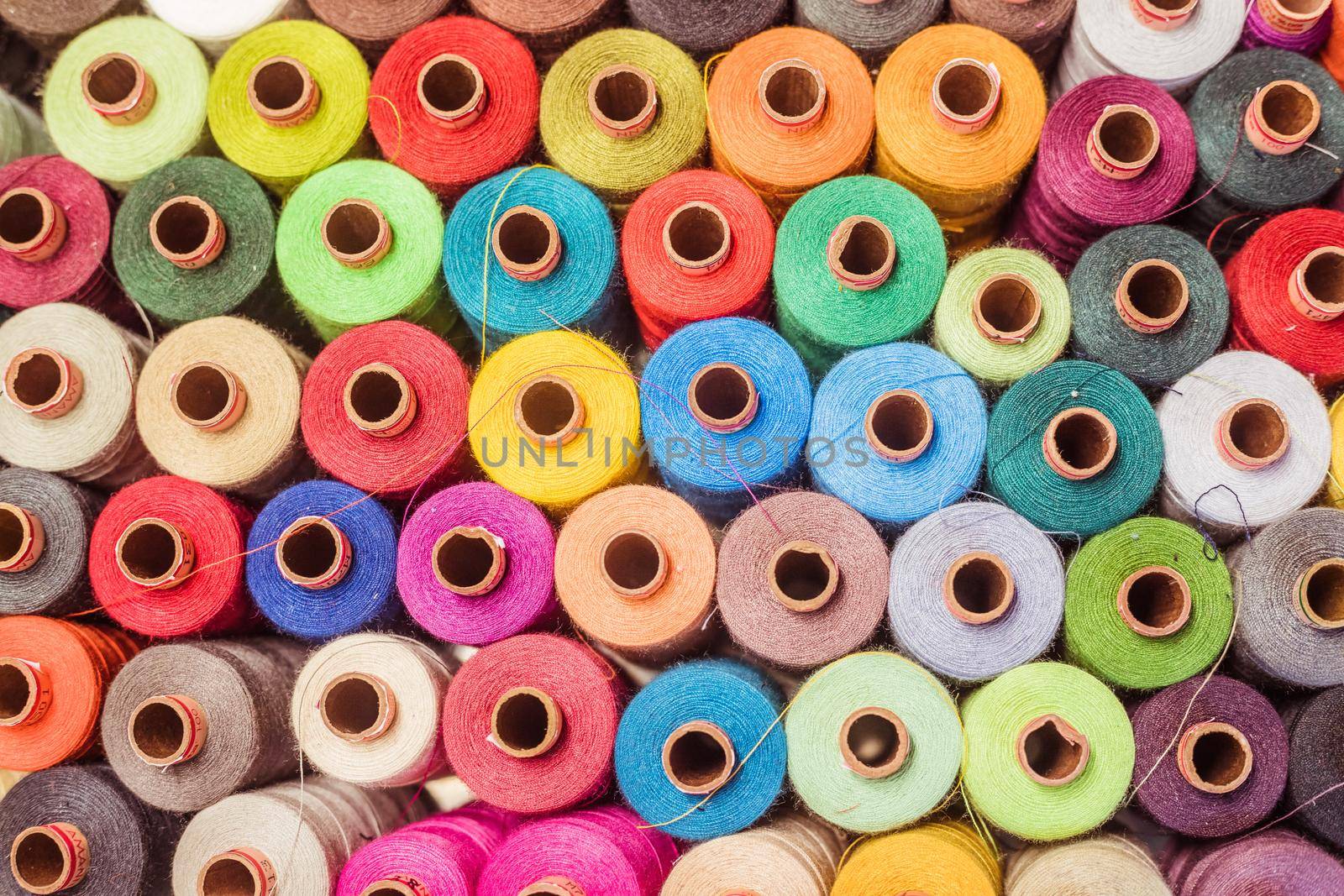 Variety of colorful sewing threads, birds eye