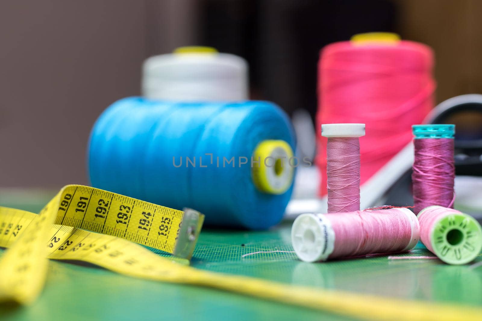 Close up of measuring tape and sewing thread a textile workshop