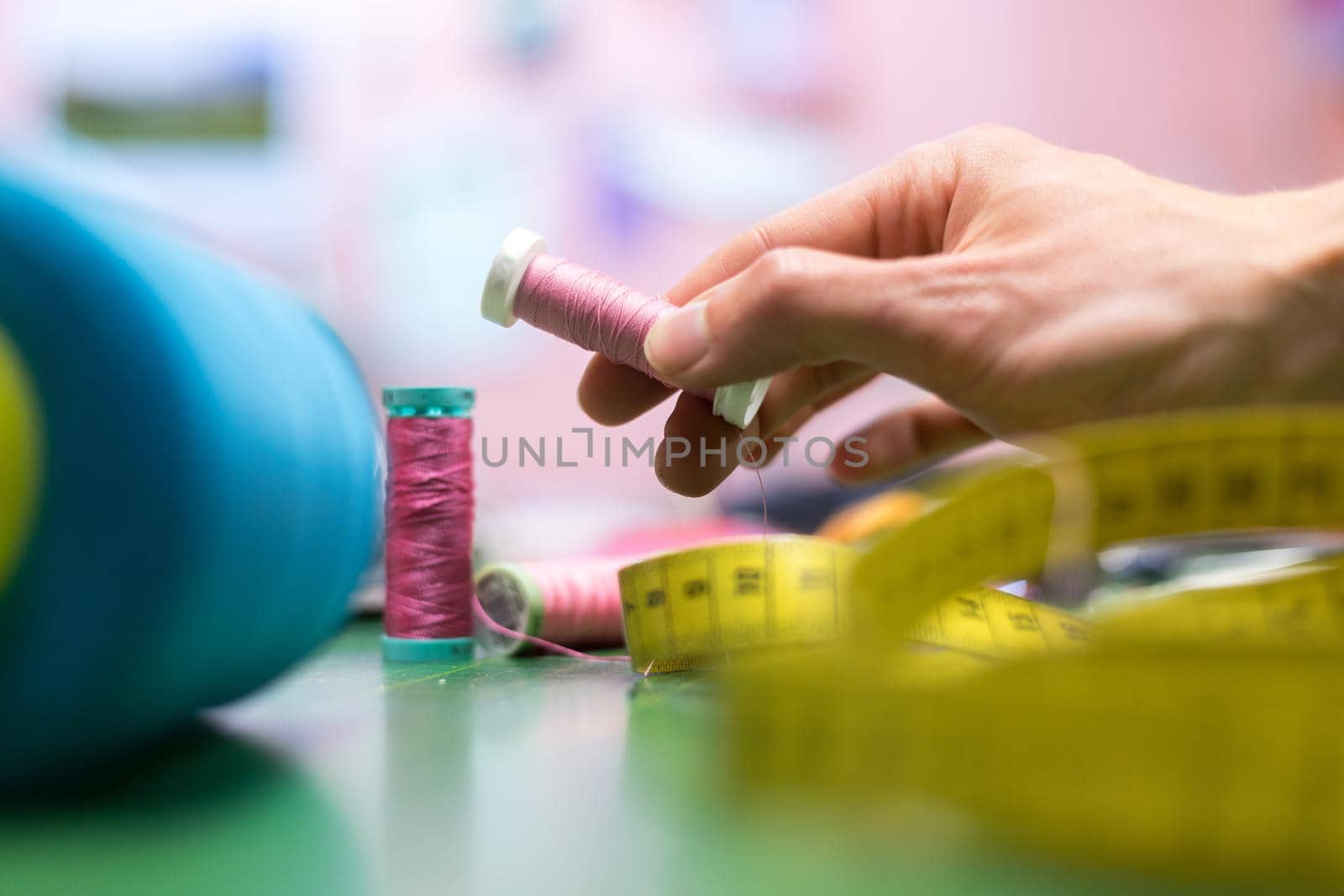 Close up of measuring tape and sewing thread a textile workshop