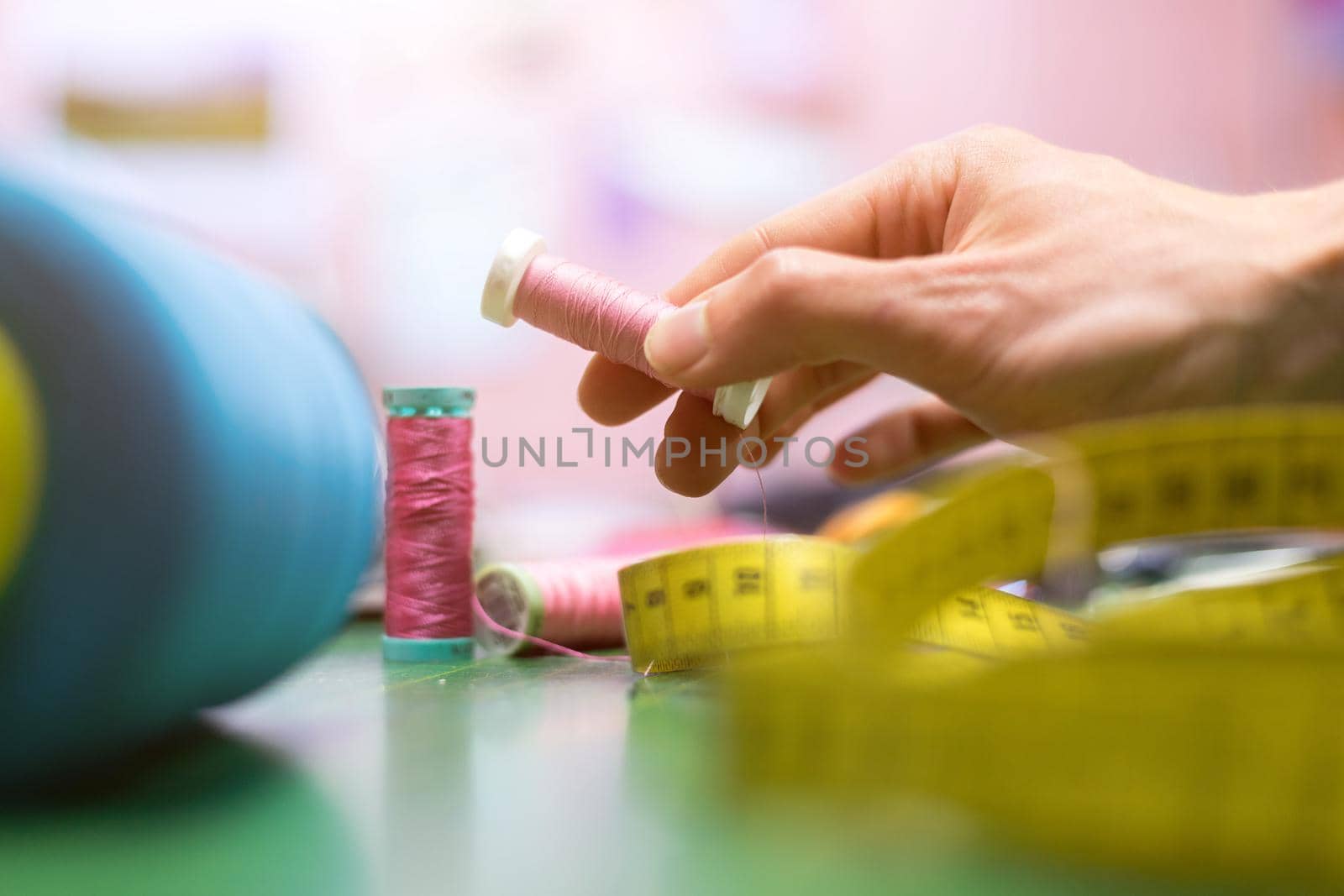 Close up of measuring tape and sewing thread a textile workshop