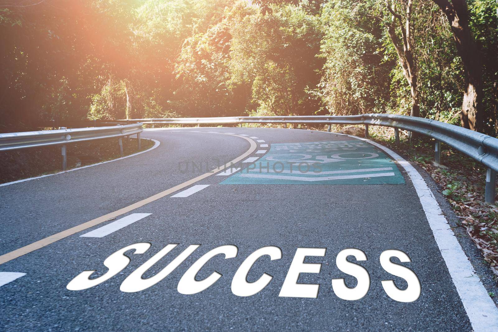 Success word on road in wood represents the beginning of a journey to the destination in business planning, strategy and challenge or career path, opportunity concept.