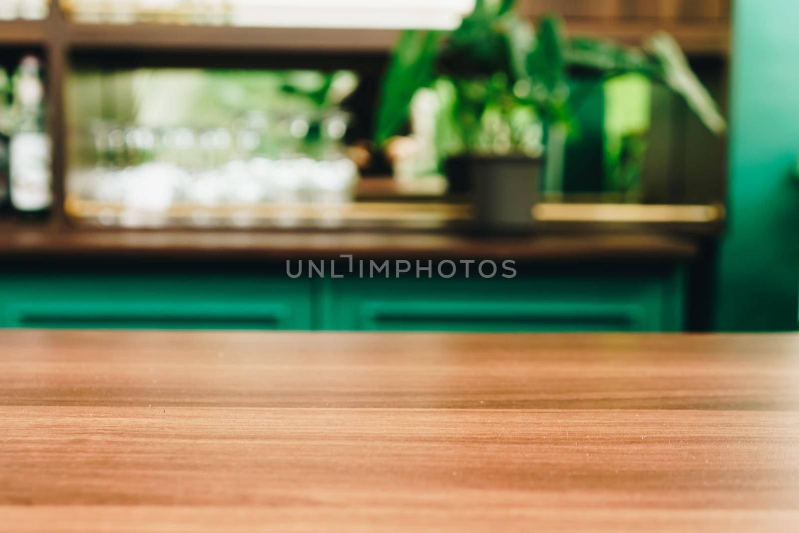 Selective focus of wooden table with blur coffee and restutant cafe with customers. by Suwant