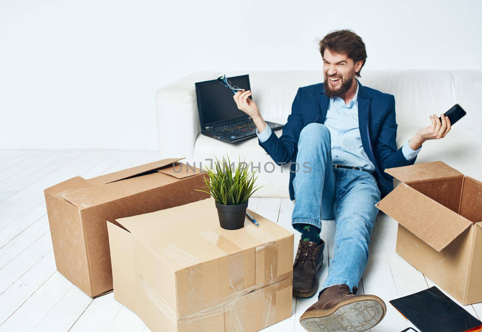 Business man boxes with things laptop office unpacking work. High quality photo