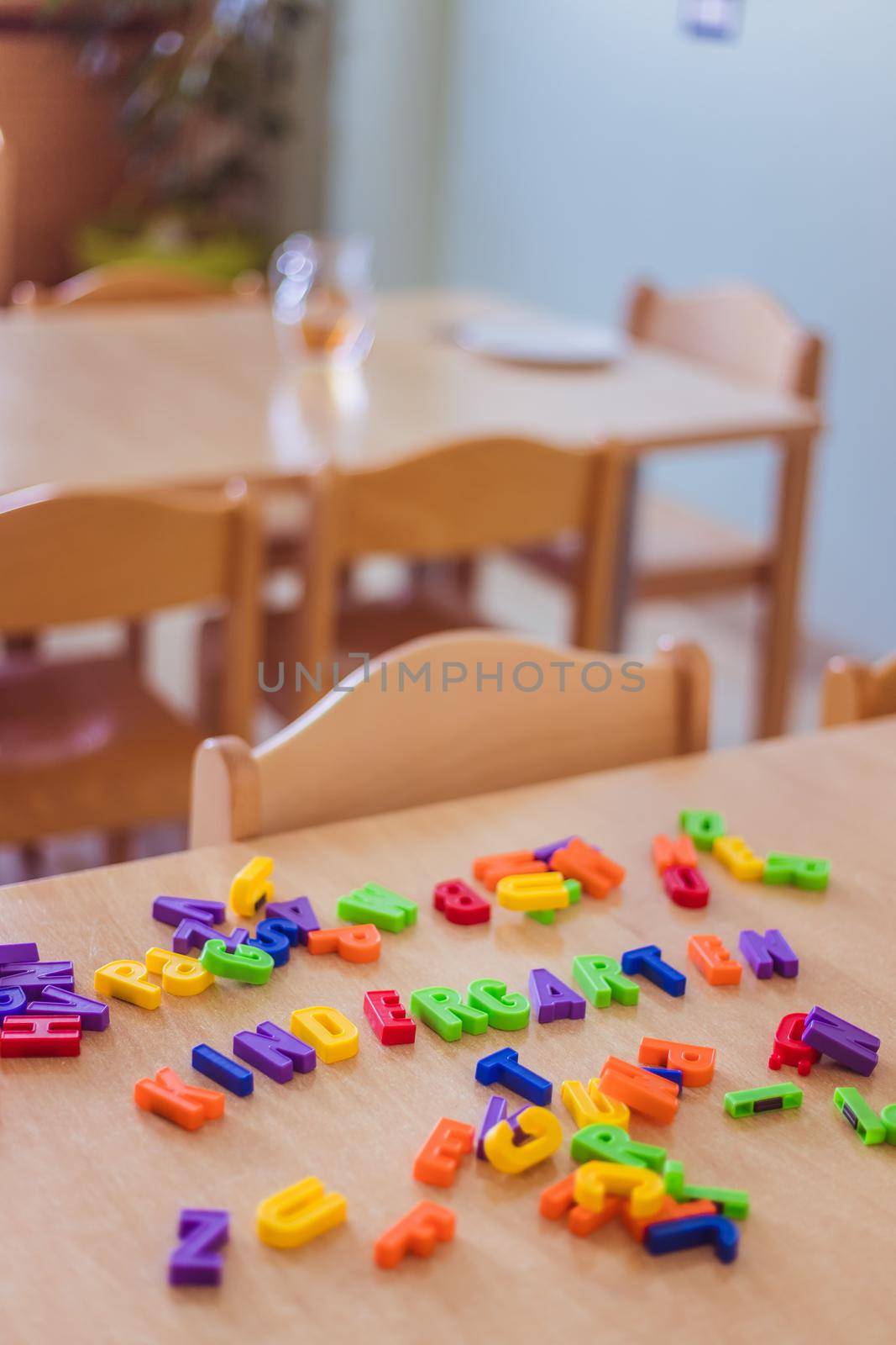 “Kindergarten” concept: Colorful letters and the word “Kindergarten” by Daxenbichler