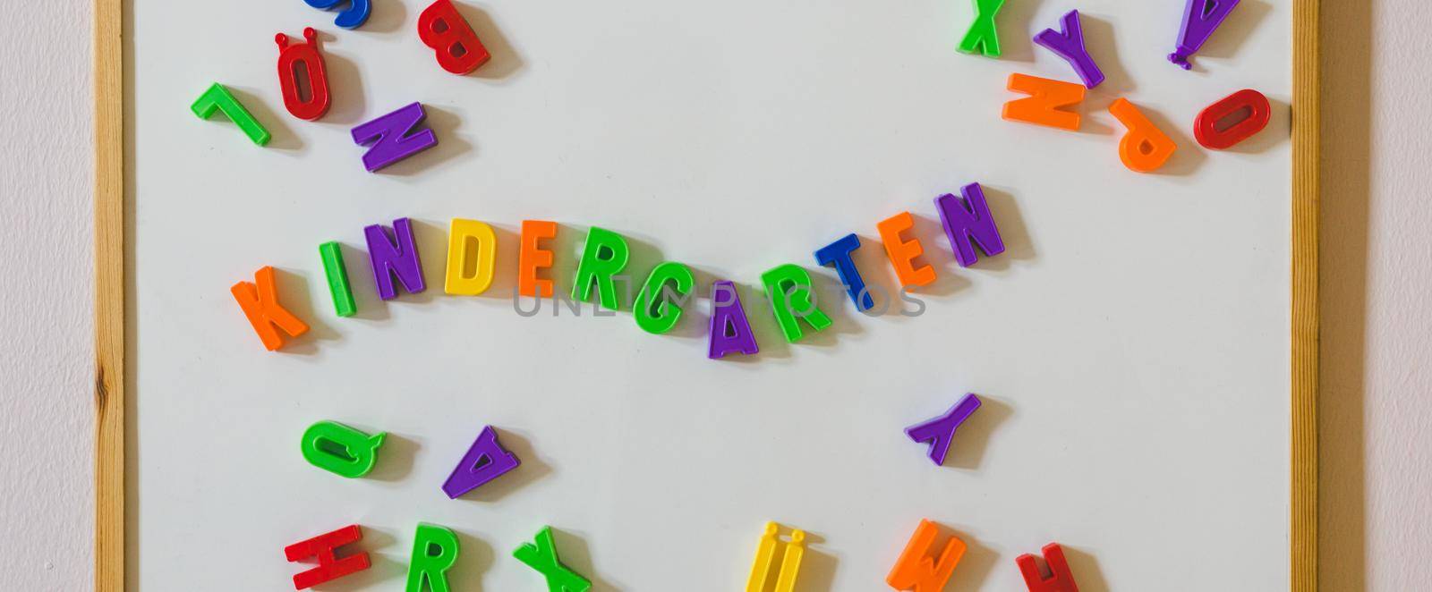 “Kindergarten” concept: Colorful letters and the word “Kindergarten” by Daxenbichler